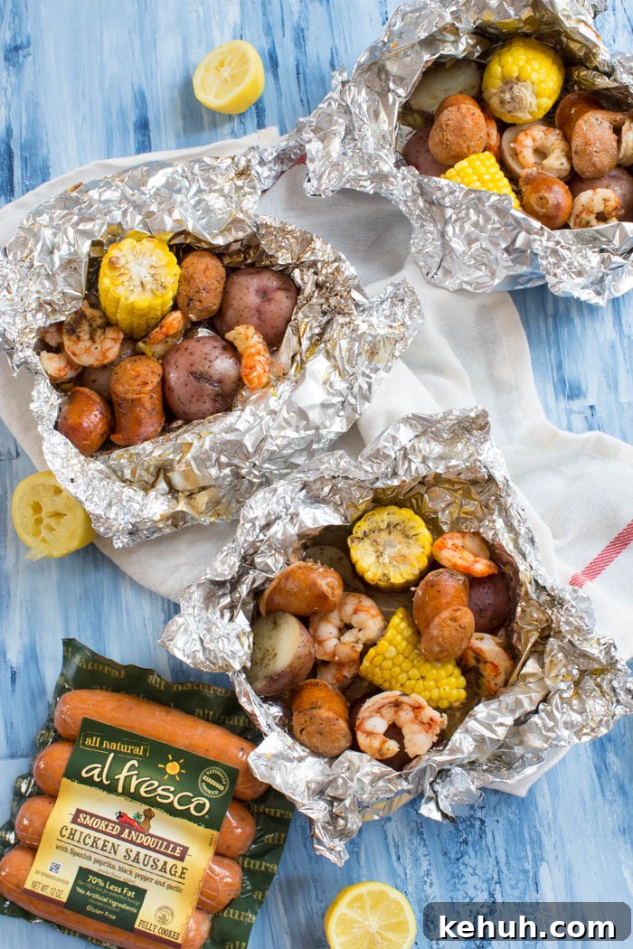 Low Country Boil Foil Pack Recipe for Seafood Camping Meals 4 Low Country Boil Foil Packs ready for the grill — less fuss and just minutes to assemble.