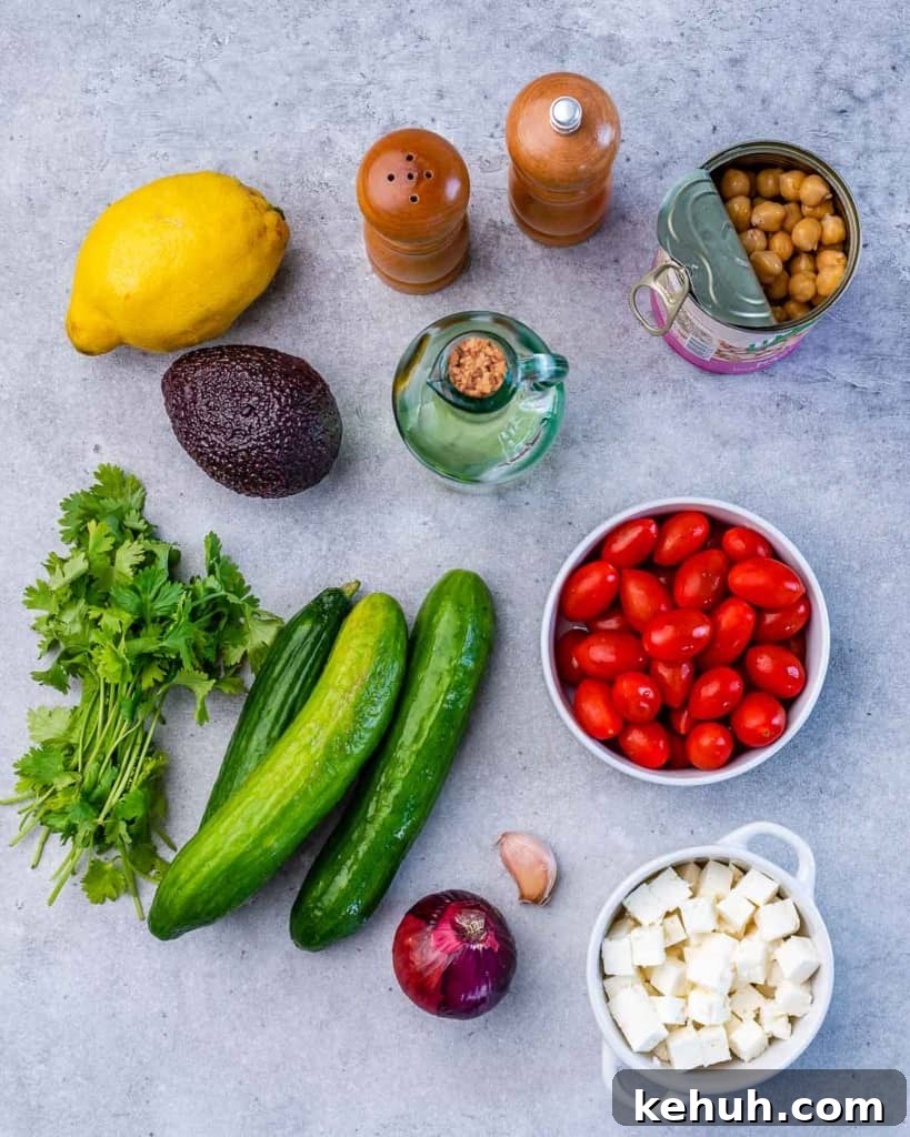 Mediterranean Chickpea and Feta Salad Recipe 4 Salad ingredients on a grey table.
