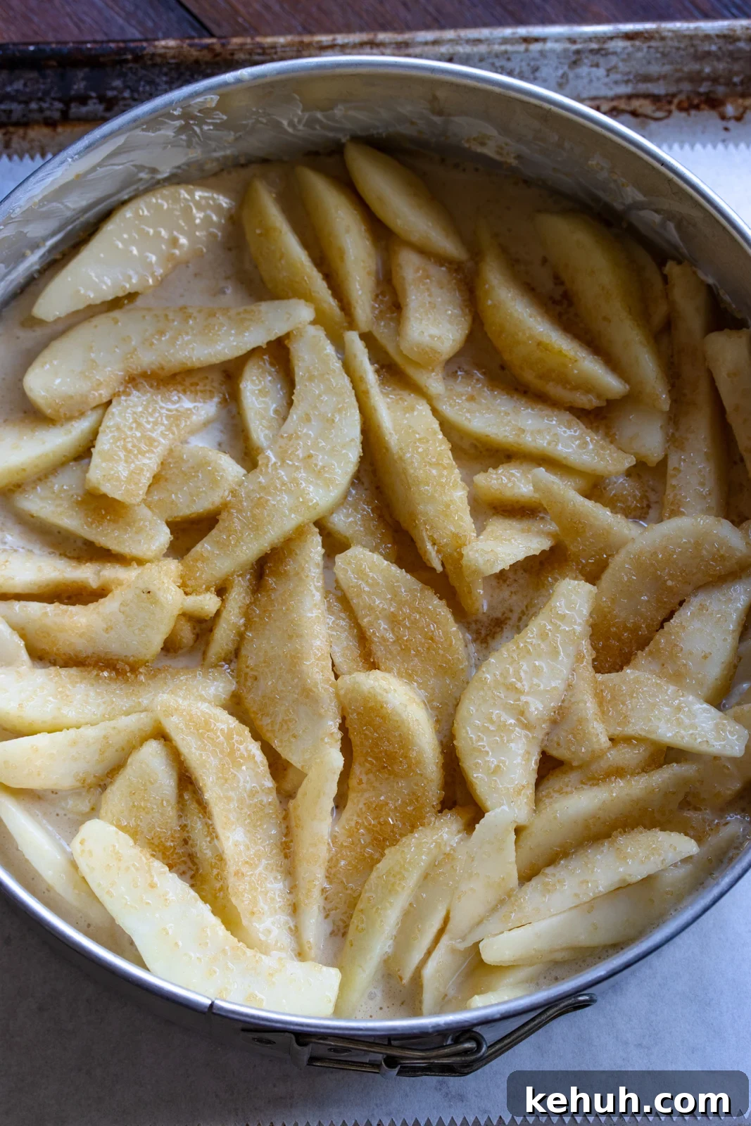 pears and batter in the springorm mold ready to go in the oven