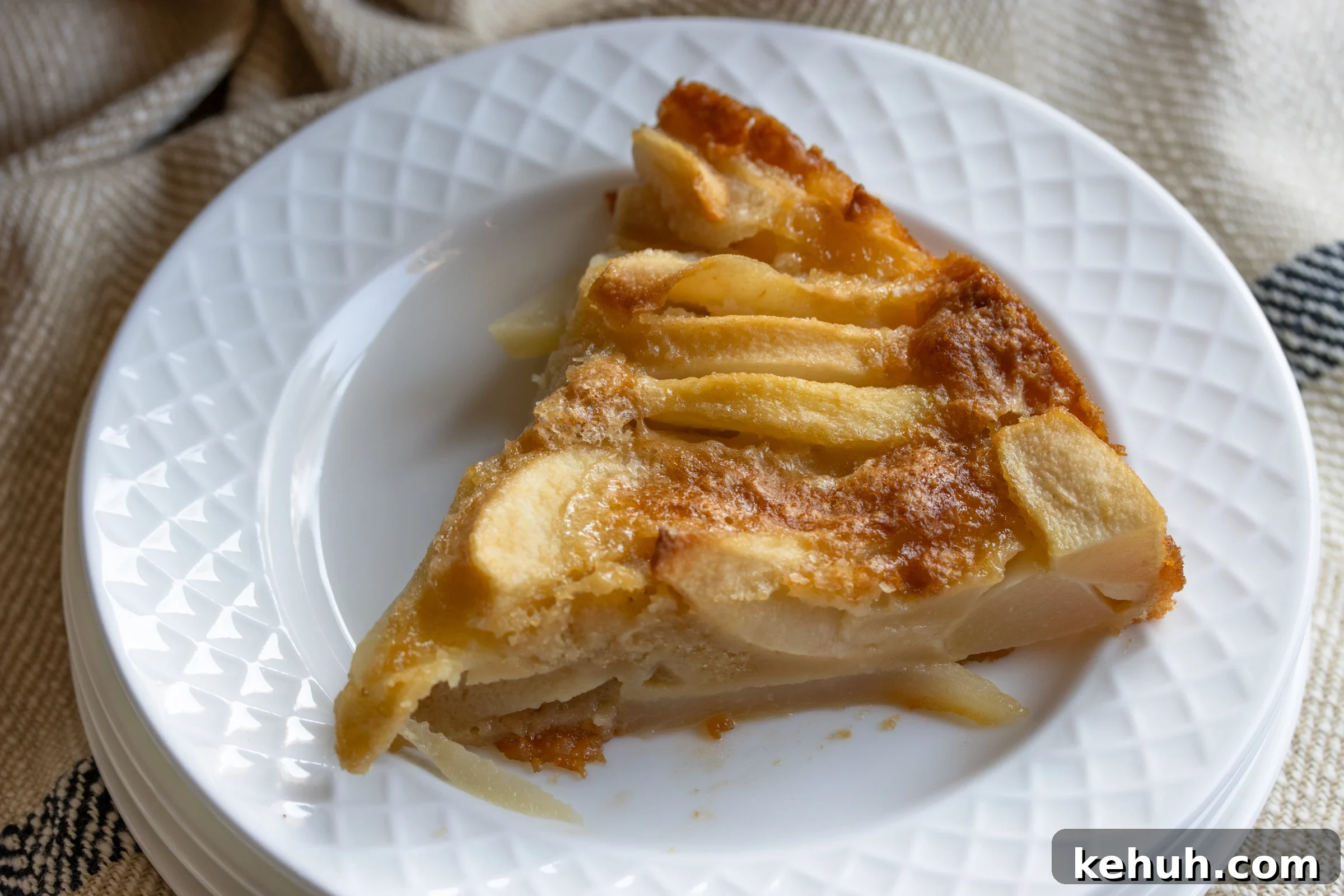 slice of pear cake on a white plate