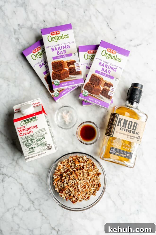 Authentic Kentucky Bourbon Balls Recipe: No-Bake Holiday Treat 3 Bourbon ball ingredients on a grey and white marble surface.