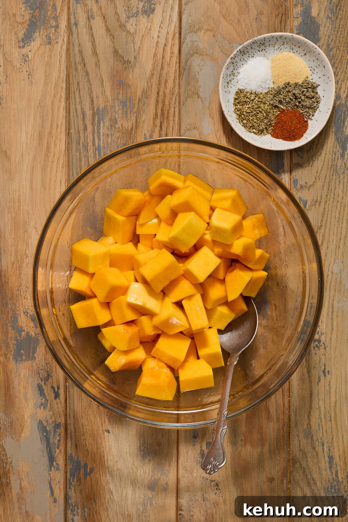Squash cubes tossed with oil and maple syrup with seasonings on the side.