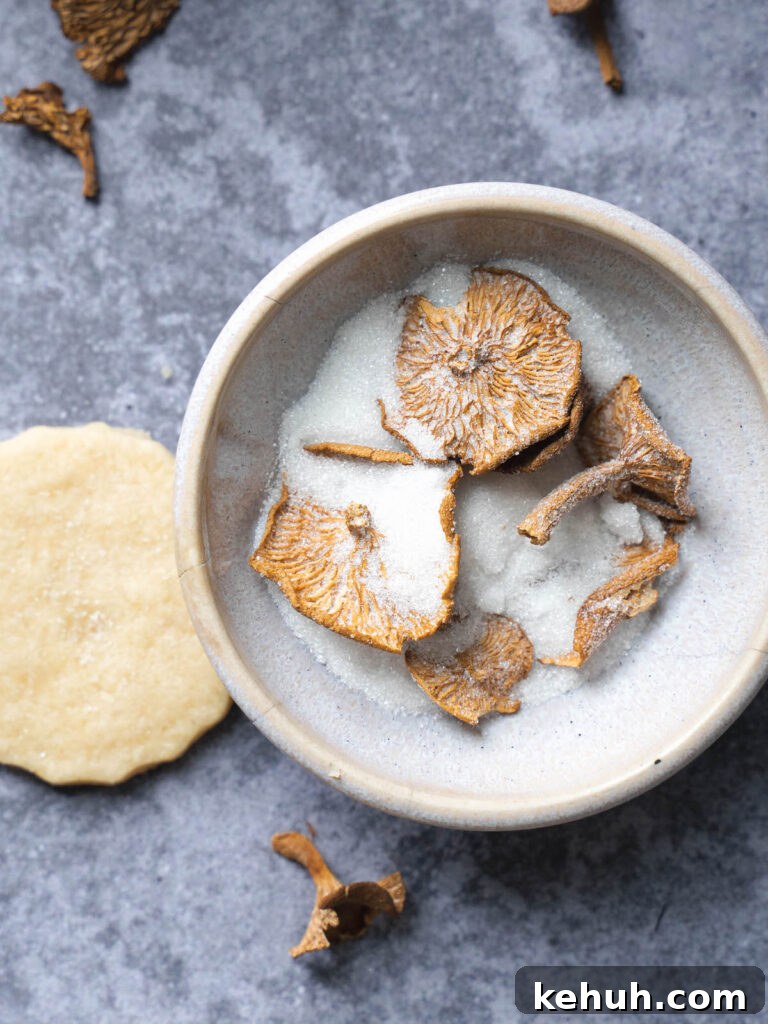 Dried candy cap mushrooms infusing in sugar