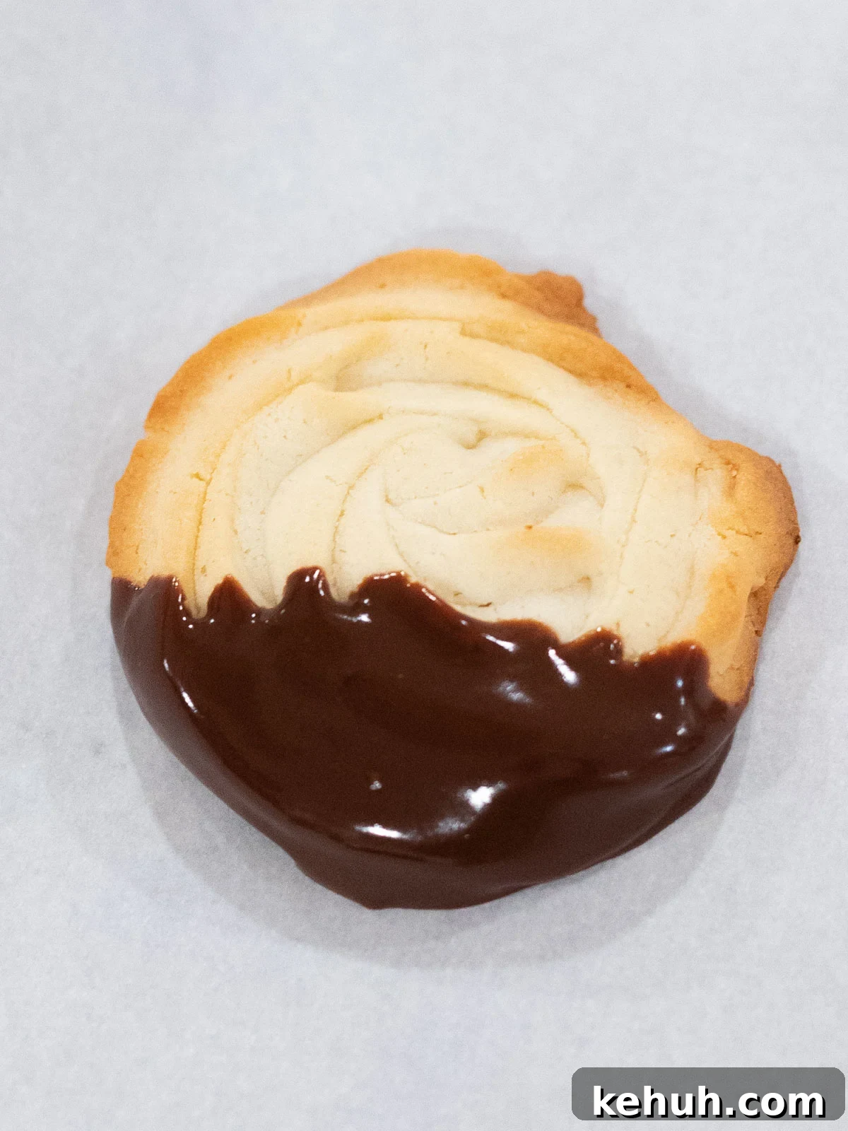 Classic Butter Cookies: Simple 6-Ingredient Recipe 9 butter cookie dipped in chocolate on parchment paper