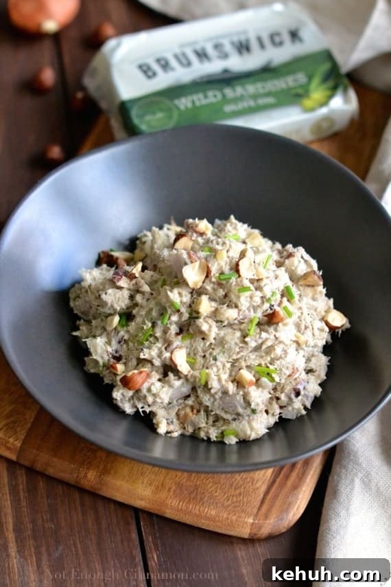 close-up of Quick and Easy Sardines Rillettes topped with chopped chives and slivered hazelnuts 