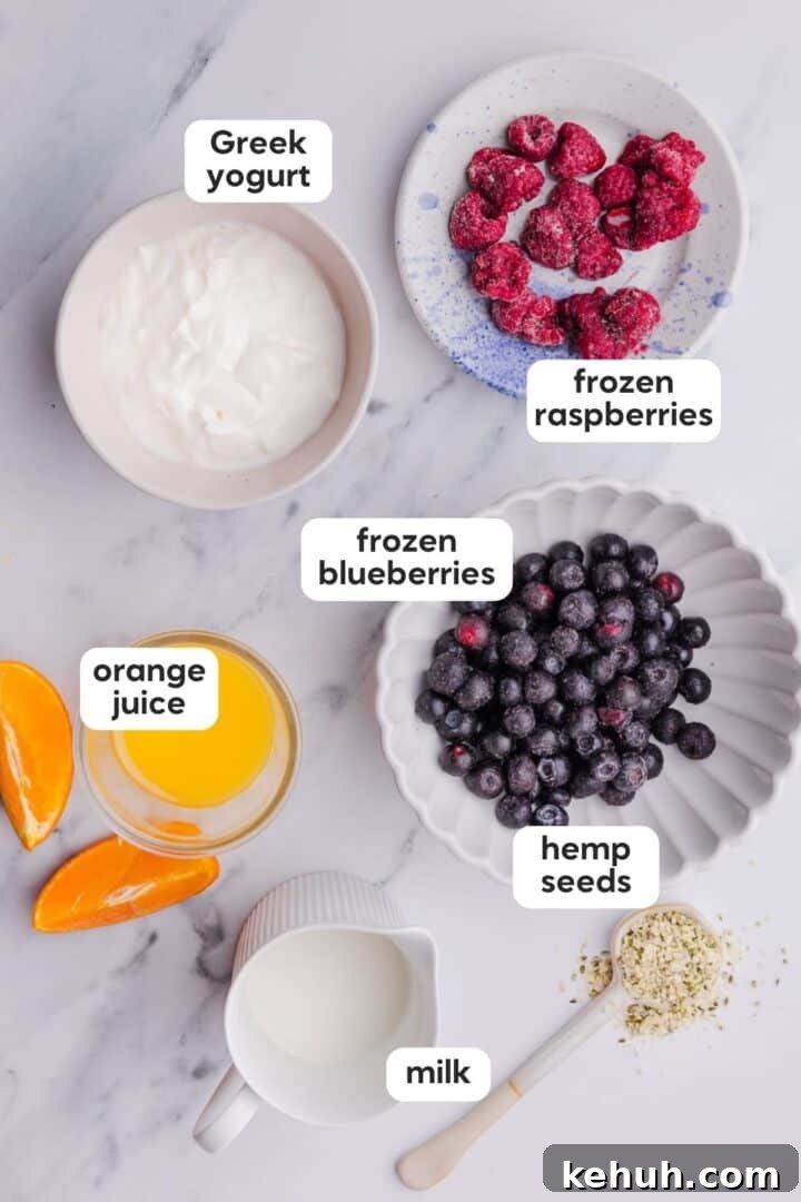Labeled photo of ingredients in a simple blueberry raspberry smoothie