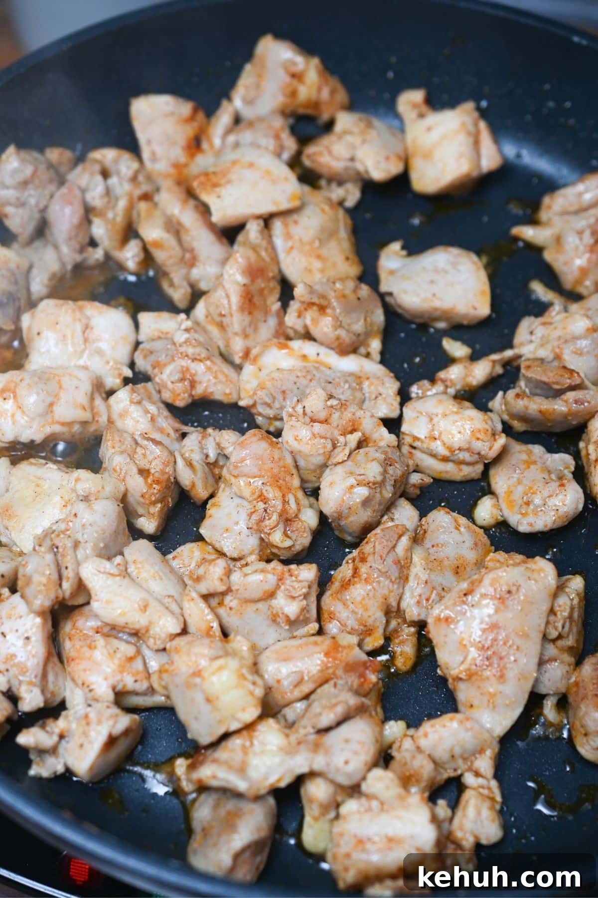 Dairy-Free Chicken Taco Skillet Recipe for Quick Weeknight Meals 5 Chicken cooking in a black skillet.