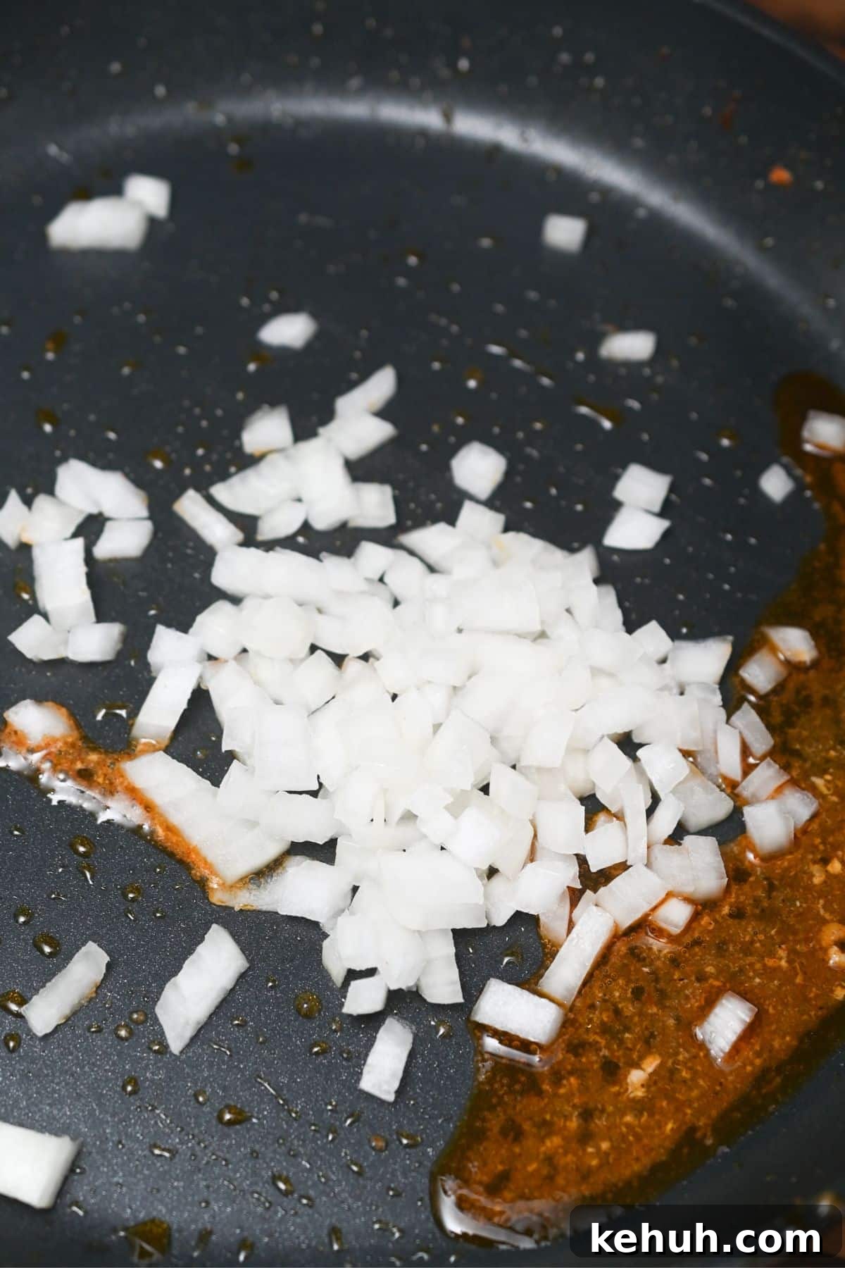 Dairy-Free Chicken Taco Skillet Recipe for Quick Weeknight Meals 6 Onion in a black skillet.