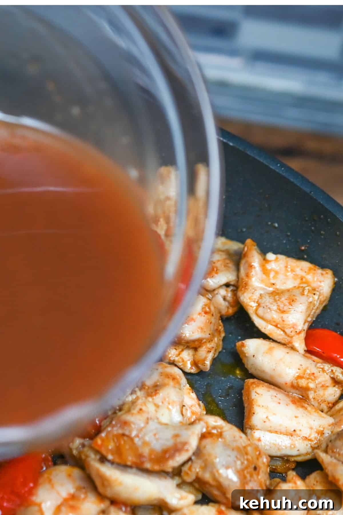 Dairy-Free Chicken Taco Skillet Recipe for Quick Weeknight Meals 7 Broth being poured from a glass bowl into a skillet of chicken.