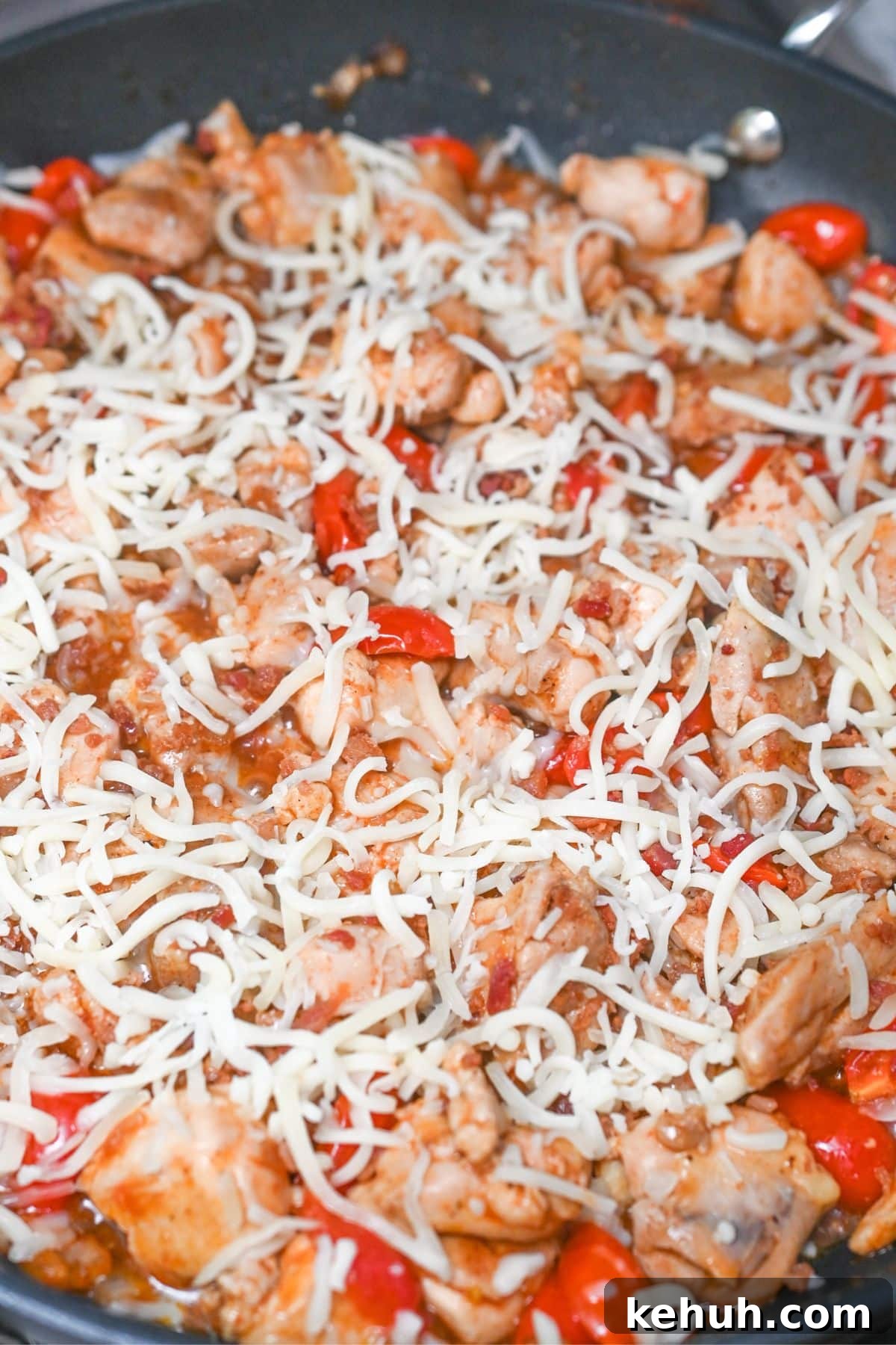 Dairy-Free Chicken Taco Skillet Recipe for Quick Weeknight Meals 8 Cooked chicken, bell peppers, and cheese in a skillet.