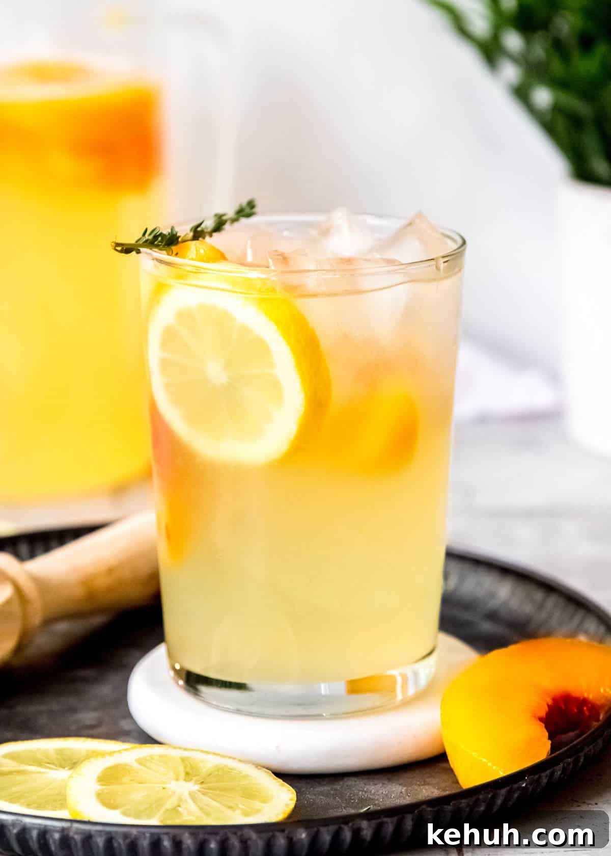 Peach Bourbon Lemonade Recipe — Refreshing Summer Cocktail 11 a fresh glass of homemade boozy peach lemonade