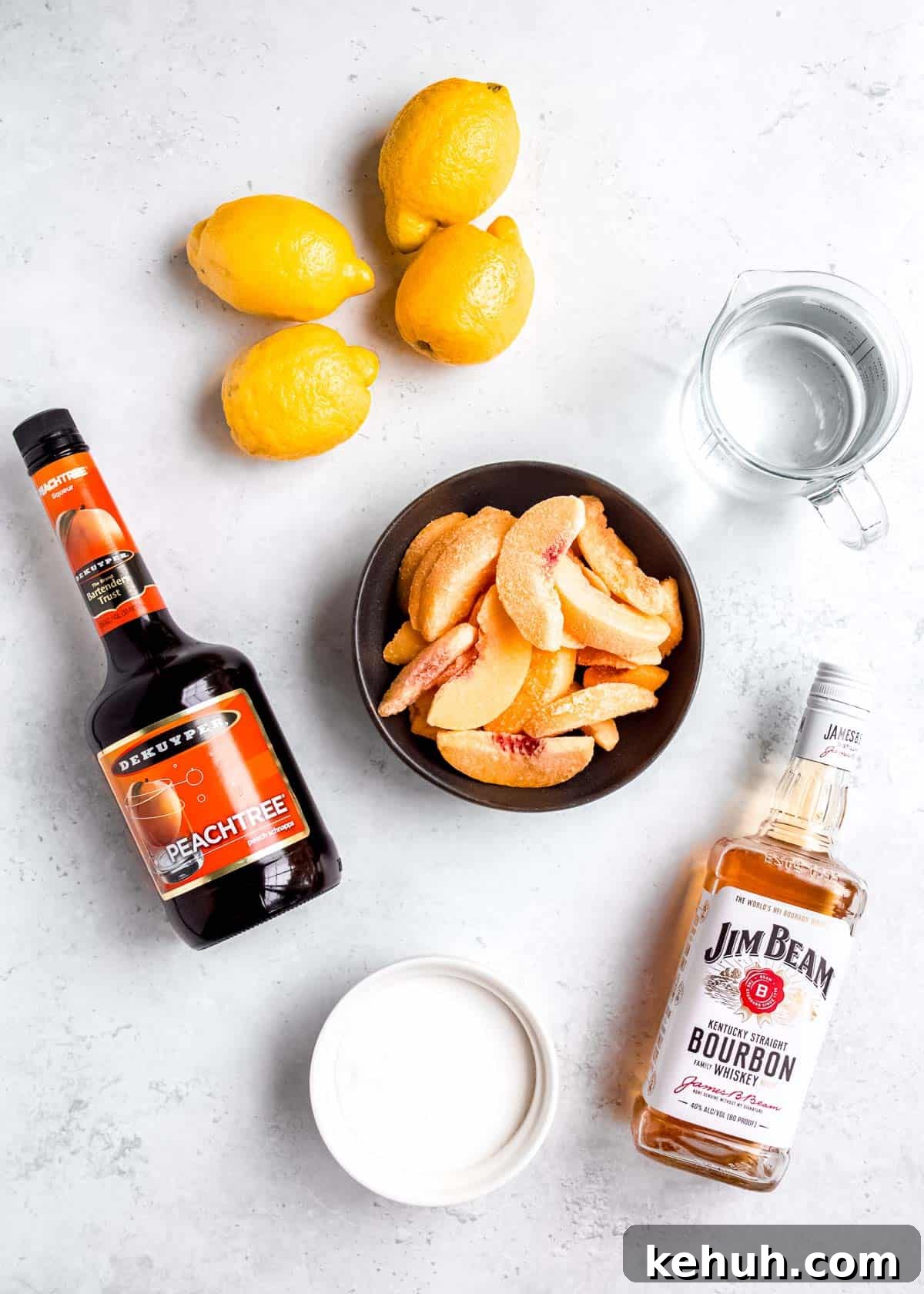 Peach Bourbon Lemonade Recipe — Refreshing Summer Cocktail 3 ingredients for a simple peach lemonade with bourbon on a countertop