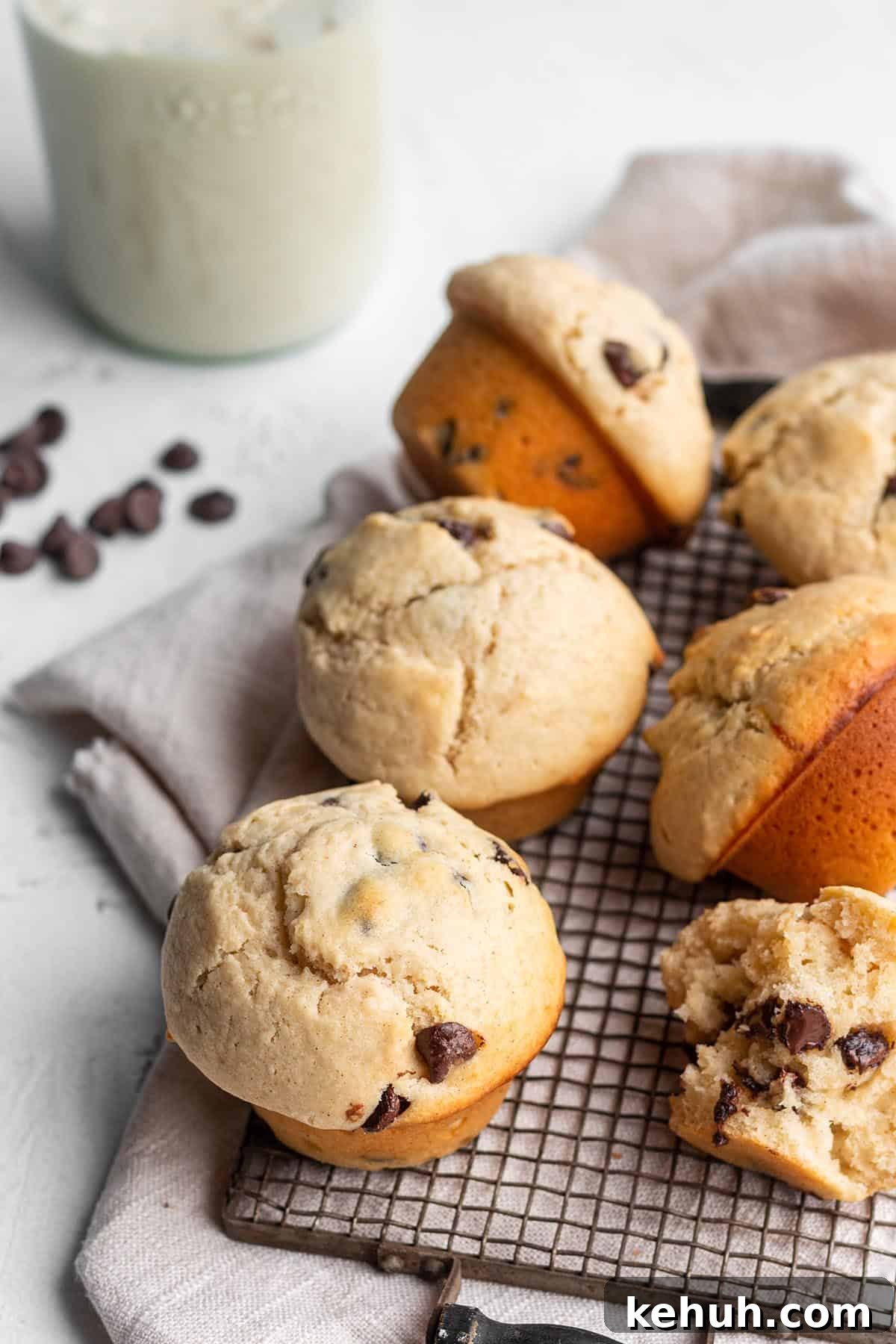 A wire cooling rack with 6 chocolate chip muffins.