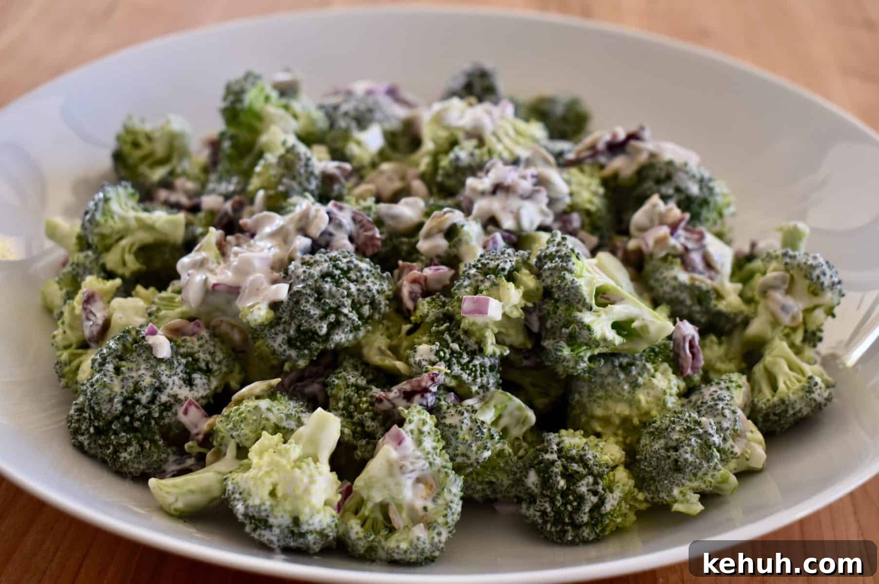Broccoli Cranberry Salad in a white bowl. 