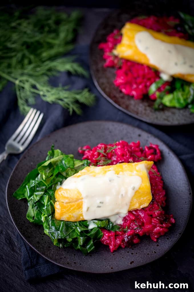 Smoked Haddock with Beetroot Risotto and Garlicky Greens on a black plate