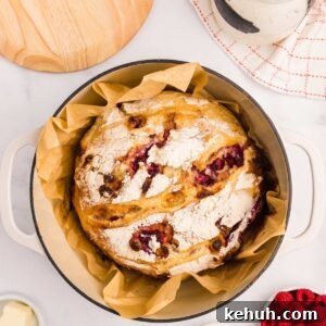 overhead view sourdough bread with raspberries and white chocolate chips.