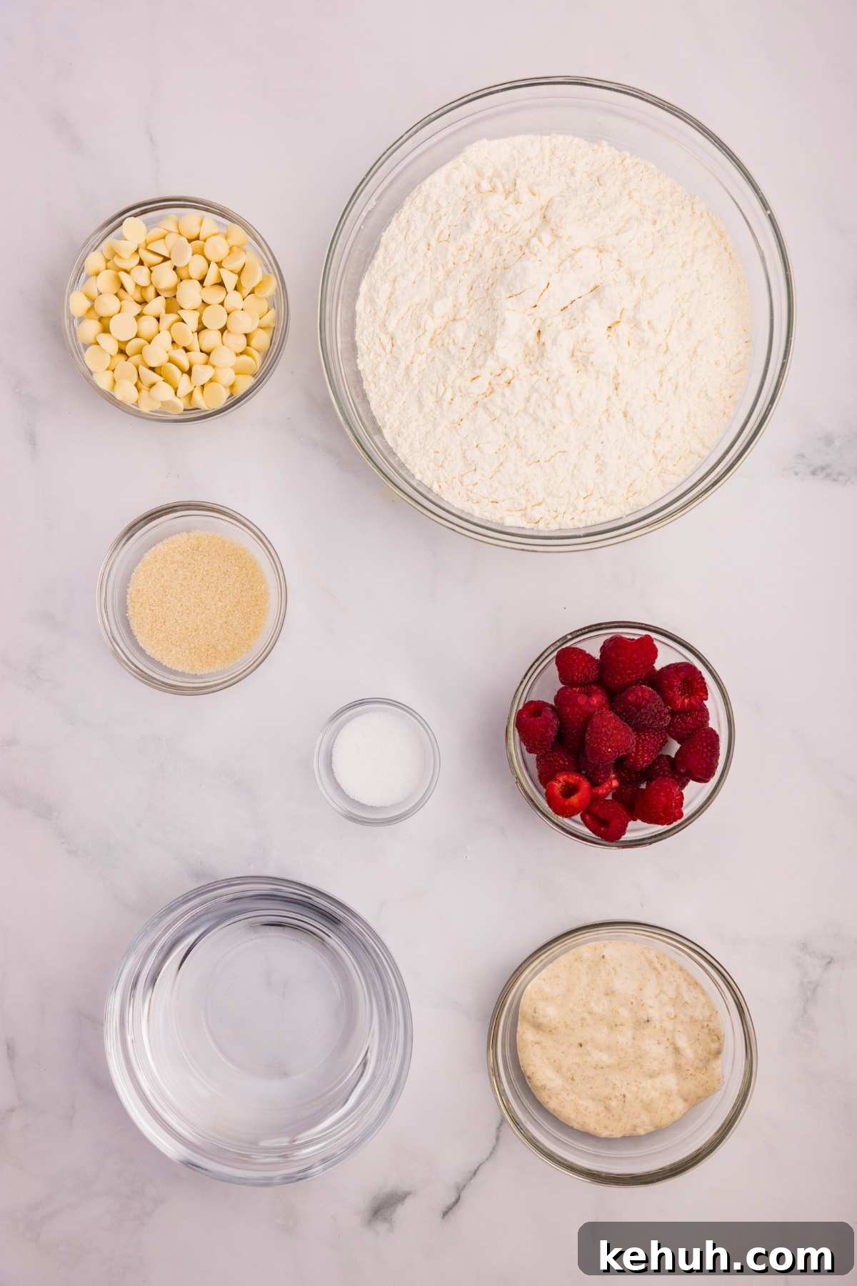 overhead shot of ingredients measured out in bowls on counter.