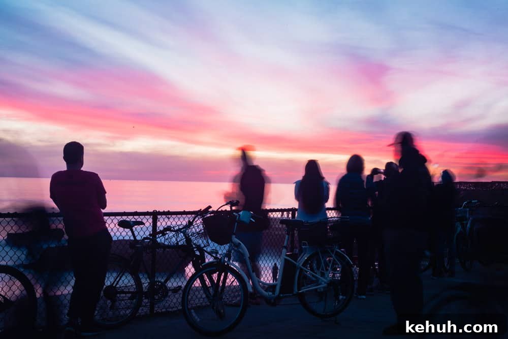 People watching a very colorful sunset in the East Side of Santa Cruz