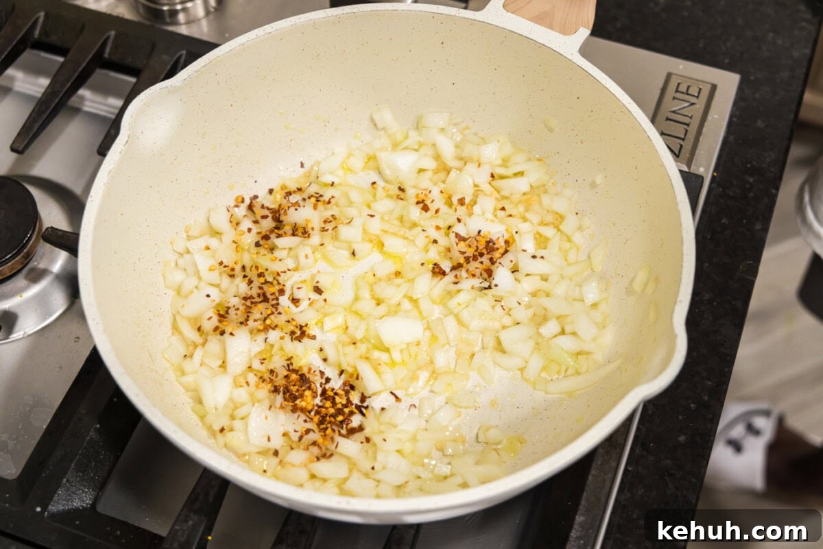 Creamy Vodka Sauce Recipe for Pasta 5 garlic, onion, and red pepper flakes in a skillet of oil