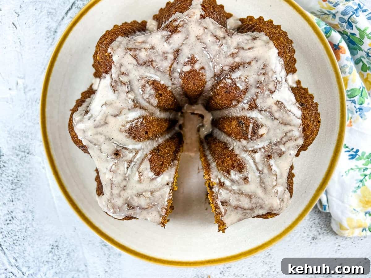 Pumpkin Chocolate Cake on a white circular plate with gold rim.