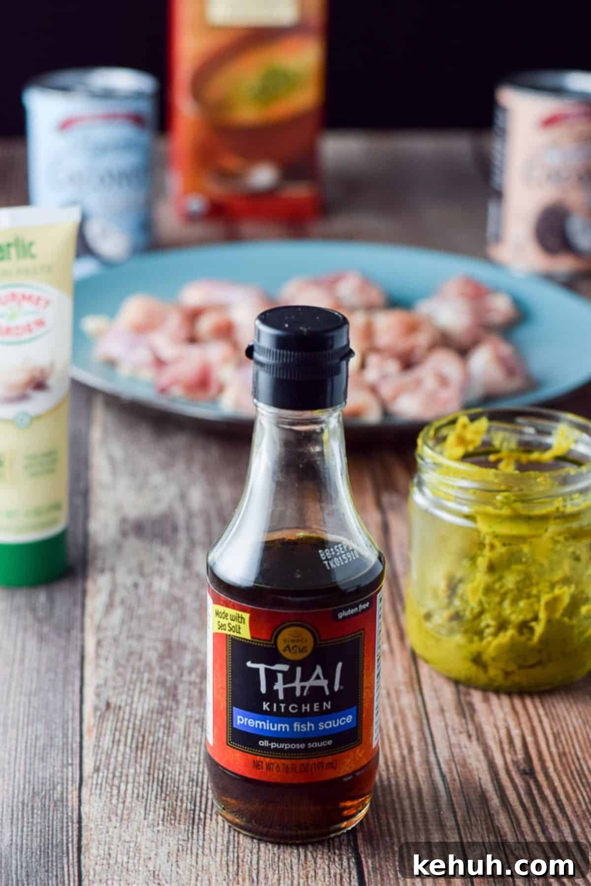 Fish sauce, curry paste, garlic paste, coconut milk and cream, broth and chicken chunks