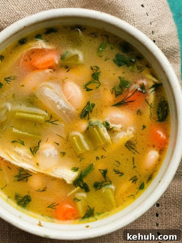 Creamy Roasted Butternut Squash Soup with Sage and Garlic 12 Bowl of lemon white bean chicken soup with vegetables and herbs.