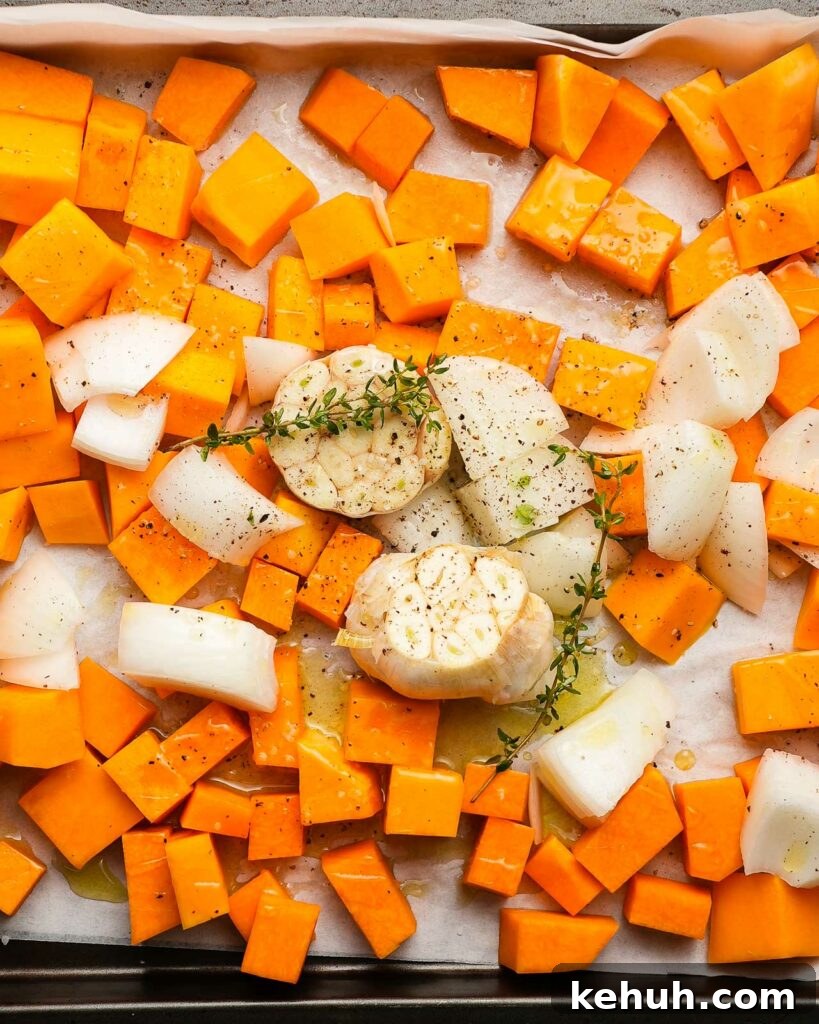Creamy Roasted Butternut Squash Soup with Sage and Garlic 8 sheet tray of butternut squash, garlic and onion ready to be roasted