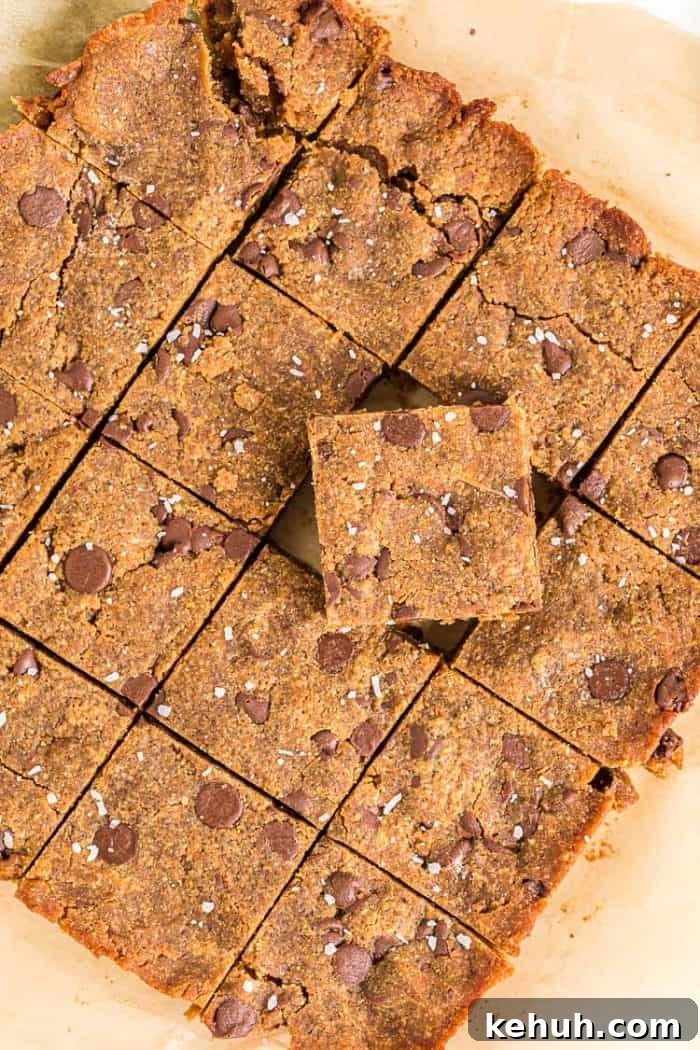 Keto Peanut Butter Chocolate Chip Cookie Bars 2 overhead view of keto peanut butter cookie bars on parchment paper