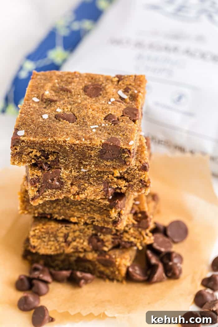 Keto Peanut Butter Chocolate Chip Cookie Bars 12 stack of keto peanut butter cookie bars on parchment paper