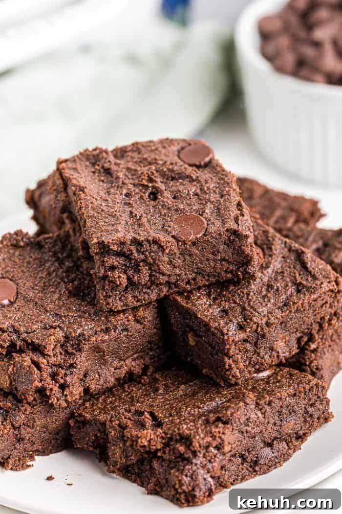 Keto Peanut Butter Chocolate Chip Cookie Bars 14 closeup of stacked keto chocolate cookies on a white plate