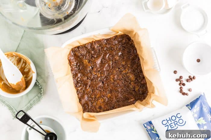 Keto Peanut Butter Chocolate Chip Cookie Bars 5 overhead view of low carb peanut butter cookie batter in a pan
